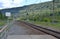 The edge of the passenger platform at a small station.