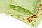 Edges of partly folded and twisted thin lavash with spinach