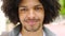 Edgy tourist with an afro getting ready for sightseeing in an urban city. Closeup portrait, headshot and face of a young