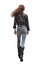 Edgy Urban Fashion: Woman in Jeans and Leather Jacket Walking Away. long auburn hair. PNG file