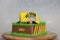 Edible Alloy Excavator Truck Car Vehicles and pile of soil with traffic cone on the chocolate cake. And text HBD