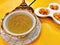Edible bird`s nest soup in benjarong Thai porcelain with designs in five colours bowl served with sweetened ginkgo.
