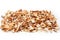 Edible dried mushrooms pile on white background close up, dry boletus edulis heap, chopped brown cap boletus, sliced penny bun