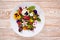 Edible flowers salad in a plate