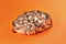 Edible natural oyster mushrooms, on an orange background, mushrooms for cooking and marinades, artificially grown mushrooms, close