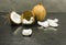 Edible part of a coconut on a wooden table.