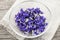 Edible violets in bowl