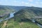 Ediger-Eller, Germany - 08 20 2020: view from Calmont the narrow land inside the Mosel curve