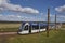 The Edinburgh Airport bound Tram departs Ingleston Park and ride station on its way to its destination.