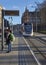 The Edinburgh Airport Tram approaches St Andrews Square Tram Stop in Edinburgh City.