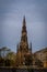 Edinburgh, Scotland - April 27, 2017: Statue of Sr Walter Scott at the base of the Scott Monument in Edinburgh Scotland