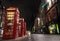 Edinburgh, Scotland - May 24, 2018 : The Royal Mile at night time, looking past red phone boxes lining the street