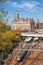 Edinburgh Waverley railway station with trains against Clock Tower building in Scotland, United Kingdom