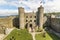 Editorial, Interior of Harlech Castle with towers, gatehouse and tourists