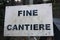 Editorial photo of a road construction site. warning signs of work in progress. cartels written in Italian. public message