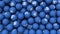 Editorial shot: filled screen 3D rendering blue balls with white icon LinkedIn. Round spheres with logo of social