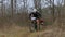 EDITORIAL. Two Mountain Bikers Racing In Forest