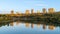 Edmonton river valley landscape with golden hour light and water reflection mix of blue and yellow colours