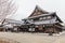 Edo period architecture style with leaves less tree in Noboribetsu Date JIdaimura Historic Village at Hokkaido, Japan
