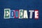 EDUCATE text word collage, colorful fabric on blue denim, general education concept