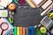 Education or back to school Concept. Top view of Colorful school supplies with books, color pencils, calculator, pen cutter clips