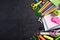 Education or back to school Concept. Top view of Colorful school supplies with books, color pencils, calculator, pen cutter clips