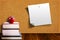 Education Concept With Apple on Books and Corkboard Background