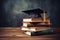 Education concept graduation cap on stack of books over blackboard