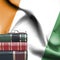 Education concept - Stack of books and reading glasses against National flag of Ivory Coast