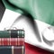 Education concept - Stack of books and reading glasses against National flag of Kuwait