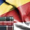 Education concept - Stack of books and reading glasses against National flag of Seychelles