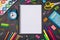 Education concept. Top above overhead view photo of blank notebook surrounded with multicolored stationery isolated on blackboard