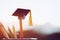 Education Graduate study concept: Black Graduation hat on pencils, blur of view outdoor. Ideas knowledge learning success