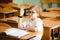 Education, high school, college. Portrait of a funny shouting student boy standing by a school blackboard