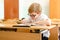 Education, high school, college. Portrait of a funny shouting student boy standing by a school blackboard