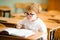 Education, high school, college. Portrait of a funny shouting student boy standing by a school blackboard