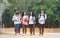 Education learning Concept: Confident Asian Students groups walking hold books, tablet notebook at Outside classroom in university