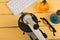 Education and science concept - microscope, computer keyboard, eyeglasses and chemical liquids on the yellow desk in the auditoriu