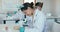 Education, science and students in laboratory with microscope for learning, lesson and practical. Chemistry, biology and