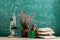 Education and sciences concept - book and microscope on the desk in the auditorium, photosynthesis formulas on the background