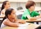 Education, students and girl in classroom with focus, attention and study at Montessori school. Children at desk