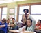 Education, teacher and kids raise their hands to ask or answer an academic question for learning. Diversity, school and