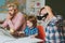 Education technology. Schoolboy studying homework at home. Father, Grandfather and child son together.