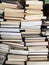 Educational books piled on table