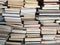 Educational books piled on table