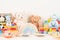 Educational kids toys collection. Teddy bear, wood plane, train, abacus, rainbow, wooden educational baby toys on white