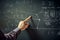 Educational lesson in school university class teacher hand fingers shows formulas drawings modern scientific plans