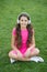 Educational podcast. Kid girl enjoy music green grass meadow. Pleasant time. Child headphones listen music. Girl