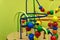 Educational wooden Logic toy with paths in Toddler baby in nursery room