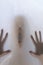 Eerie blurry hands of people as if they have been trapped behind glass, dense fabric, wrap, ghost, spirit trying to reach out from